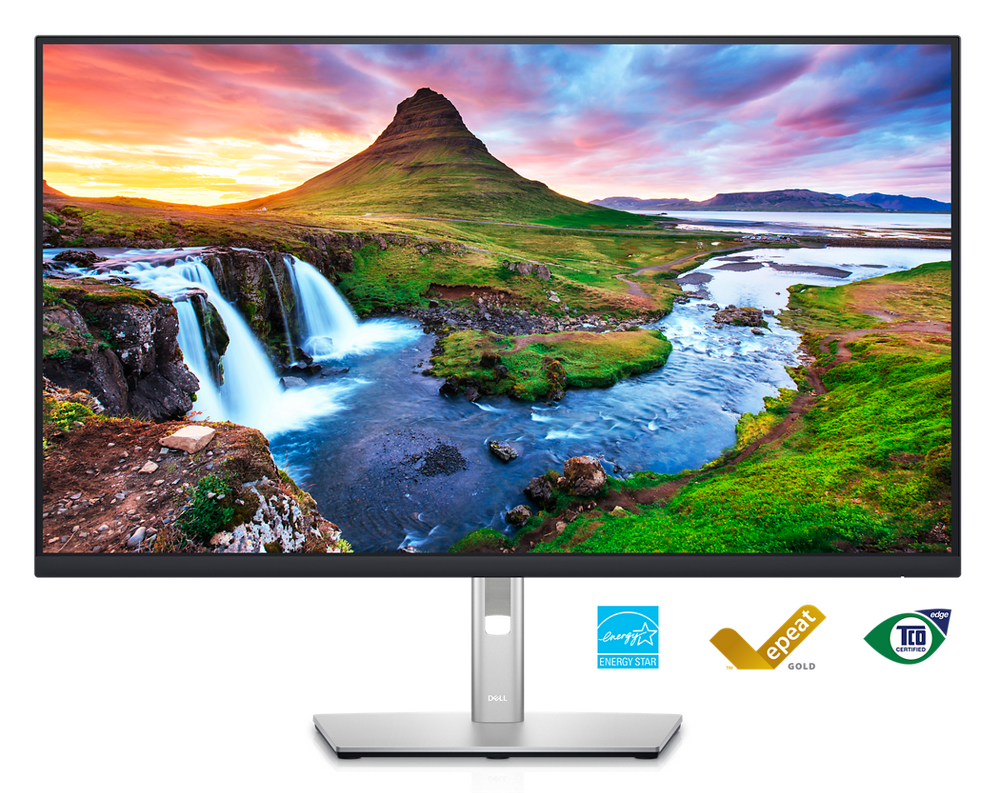 Picture of a Dell P3223QE Monitor with a nature landscape background on the screen. 