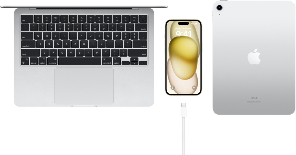 Vedere de sus a MacBook Pro, iPhone 15 cu un conector USB-C si iPad